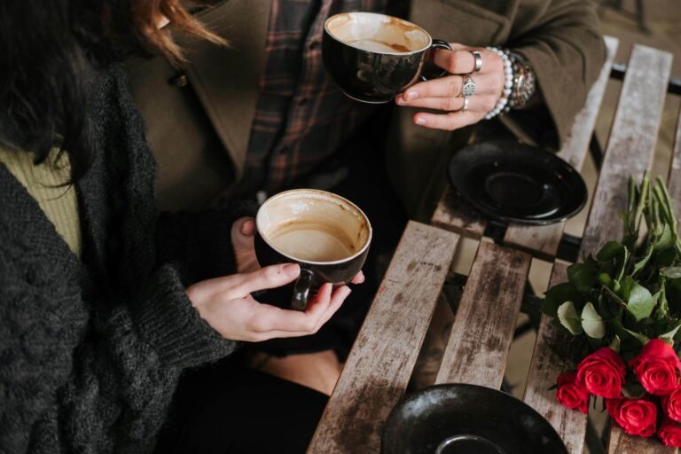 two people sharing coffee